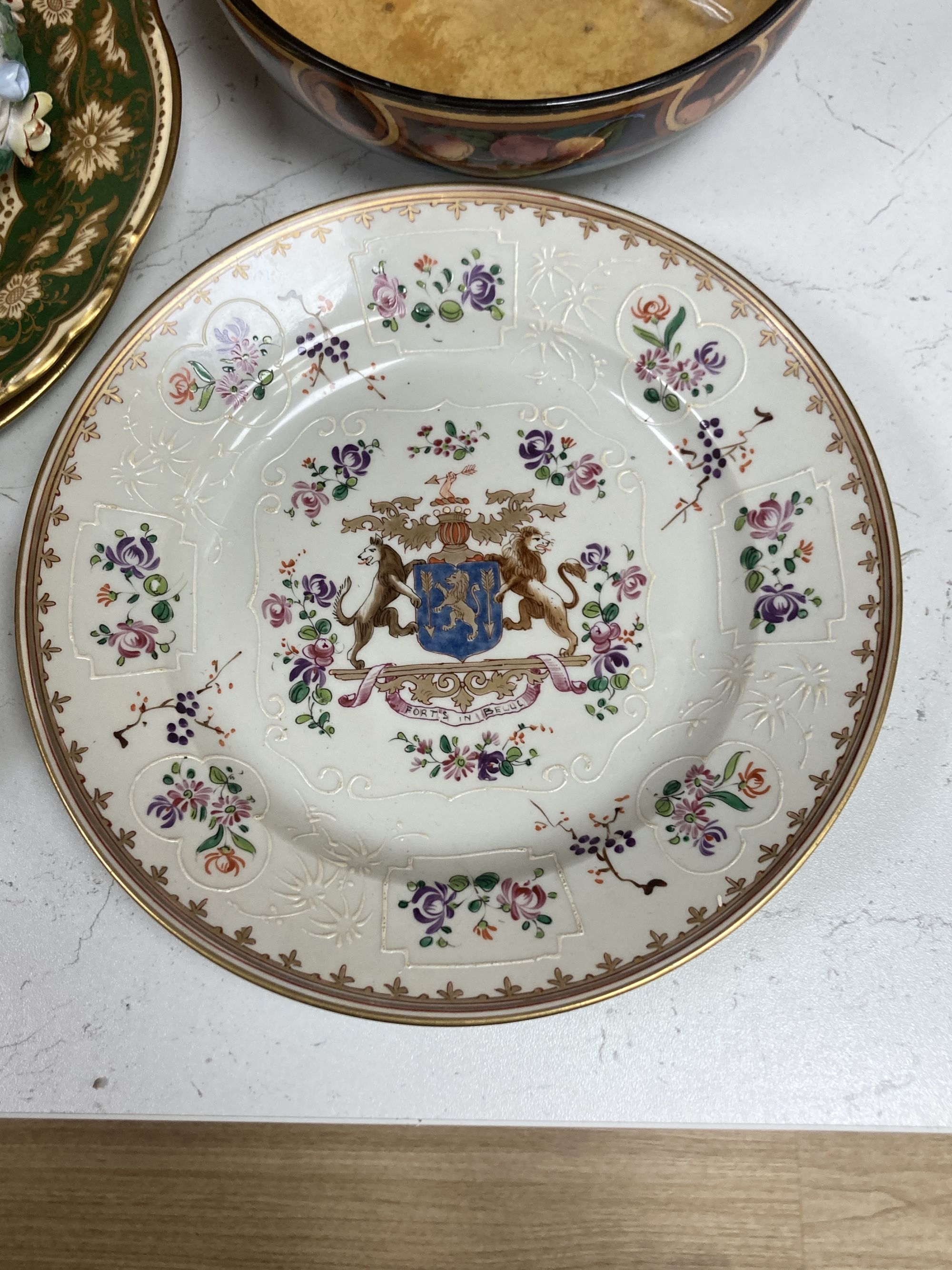 A Continental porcelain shaped oval posy basket encrusted with carnations and sundry ceramics,